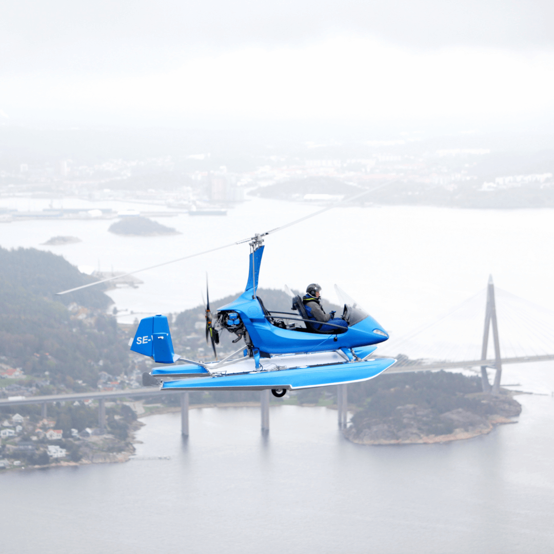 AutoGyro MTOamphib flying over river 