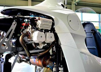 AutoGyro Close-up of a small aircrafts open engine compartment in a hangar, poised for a successful certifications achievement